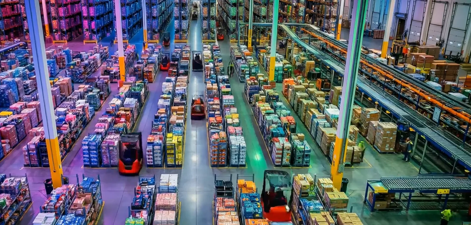 Illustrative warehouse conveyor system carrying cartons towards dispatch